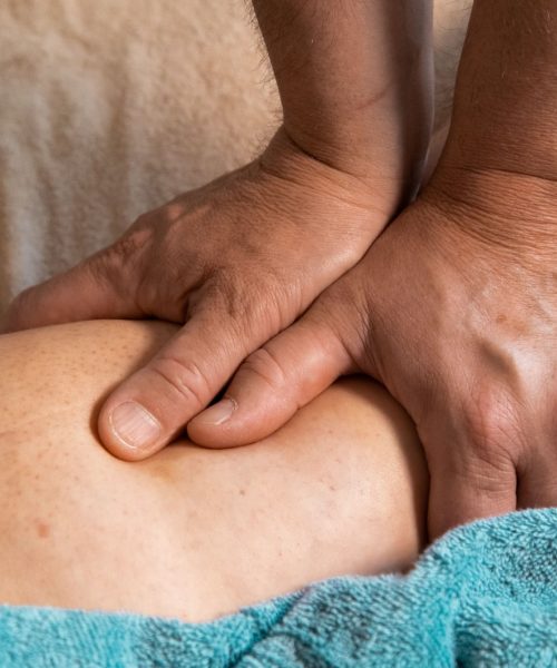persons feet on blue towel